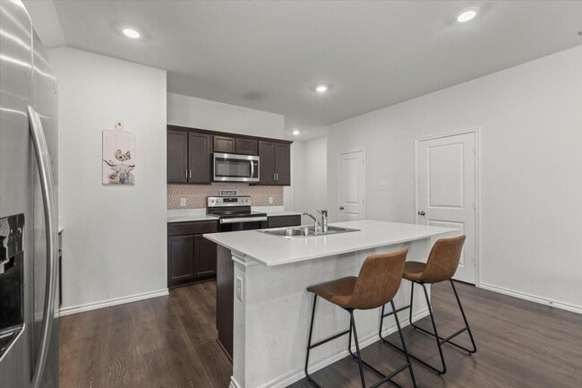 Photo - Modern single-story home with 4 bedrooms, 2 bathrooms, open-concept living, stylish kitchen, two-...