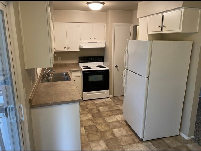 Kitchen with balcony/ patio outside - 414 N Saint Bernard Dr Unit 414 N. Saint Bernard Dr.