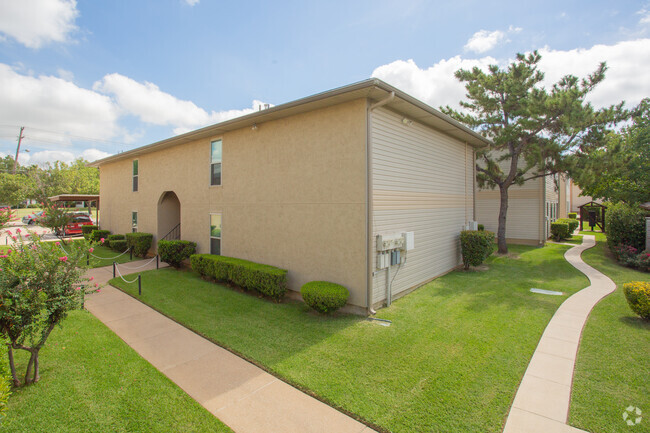 Archway Entrance on West Oak St. - Pecan Grove Apartments