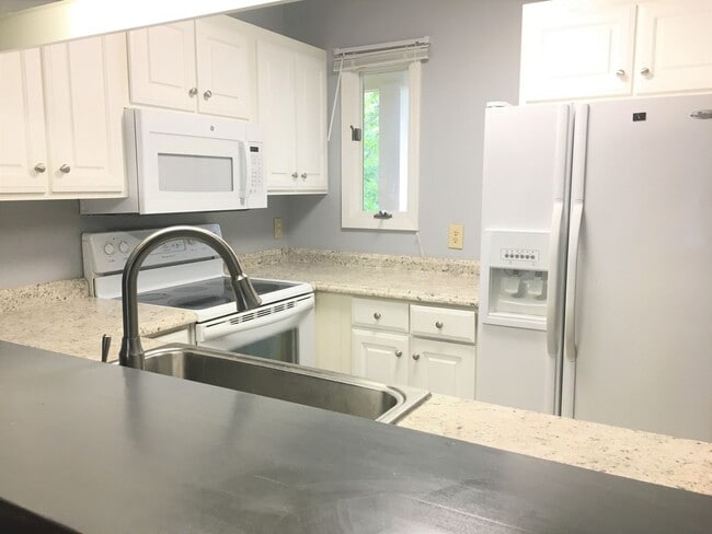 Photo - Updated, spacious 4br 2ba condo within wal... Unit G8