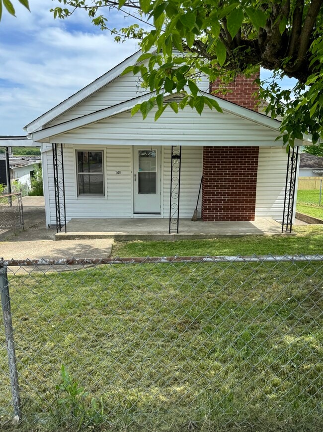 Front yard, and driveway with carport - 1558 2nd St House