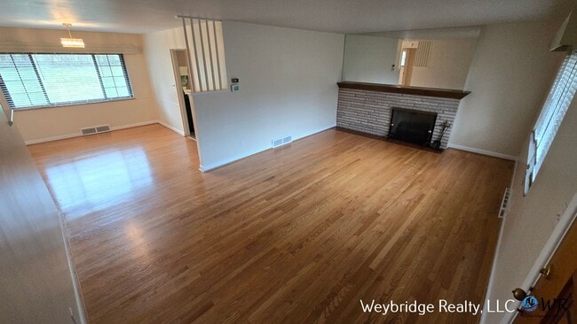 Photo - Charming Mid-Century 2BR Home with Sunroom, Fireplace & Fenced Yard