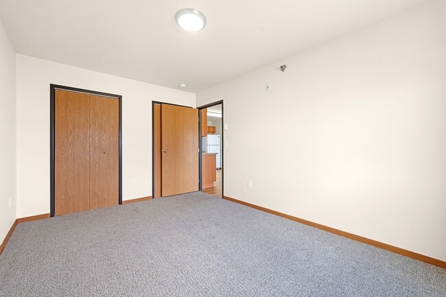 Step into spacious living at Paramount at the Bluffs Apartments. This inviting area features plenty of natural light and ample closet space, perfect for your lifestyle. Don't miss out on your ideal home—schedule a tour today!