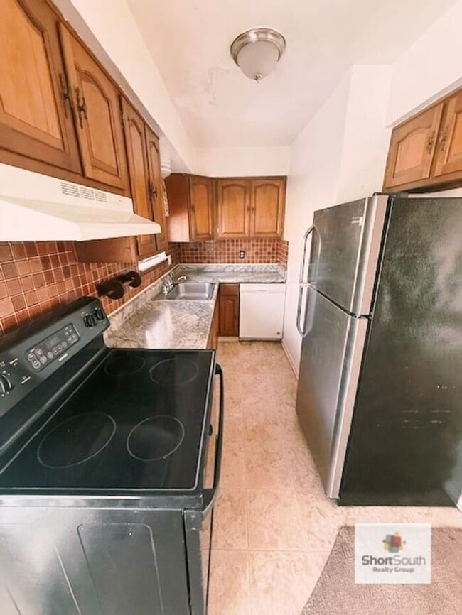 Photo - Updated - 2 bed 1.5 bath, Duplex with attached garage and fenced in backyard