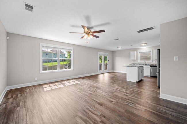 Photo - Beautiful Open-Concept Home with Covered Deck & Huge Backyard