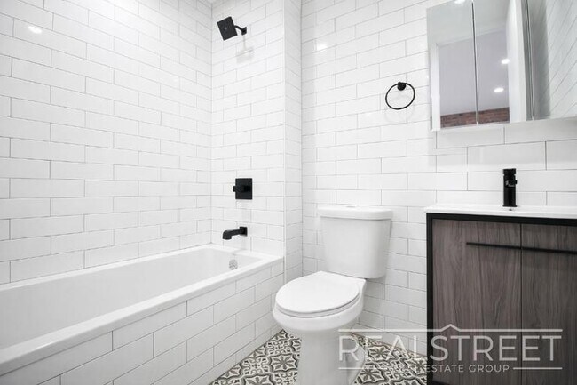 Photo - Modern & Bright 2BR with Rooftop Deck, Central A/C & Dishwasher | Bed-Stuy/Bushwick Border Unit 4B