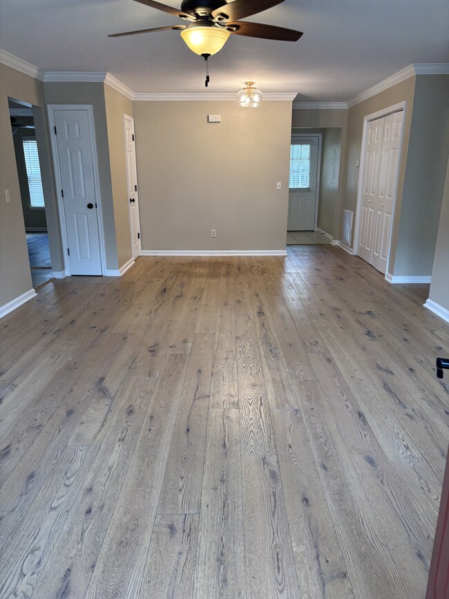 Living room / dining area/ 2 closets - 1315 Moice Dr Unit #2