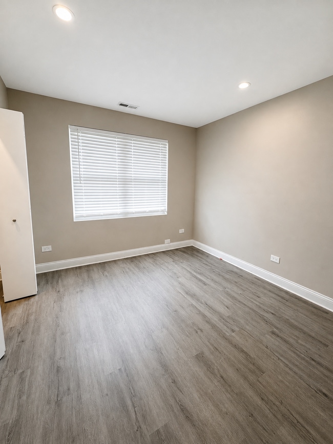 Photo - Updated 2-bedroom apartment with parking, front/rear access, modern flooring, full kitchen, and l... Unit C