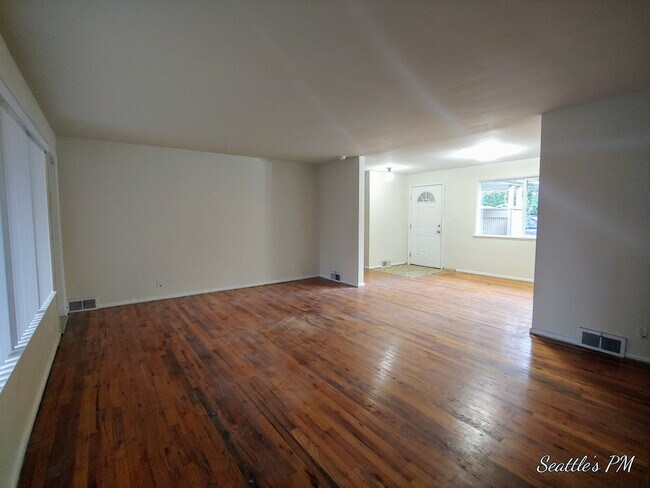 Photo - "Charming 2-Bed Retreat with Gleaming Hardwood Floors in Prime Seattle Location!"