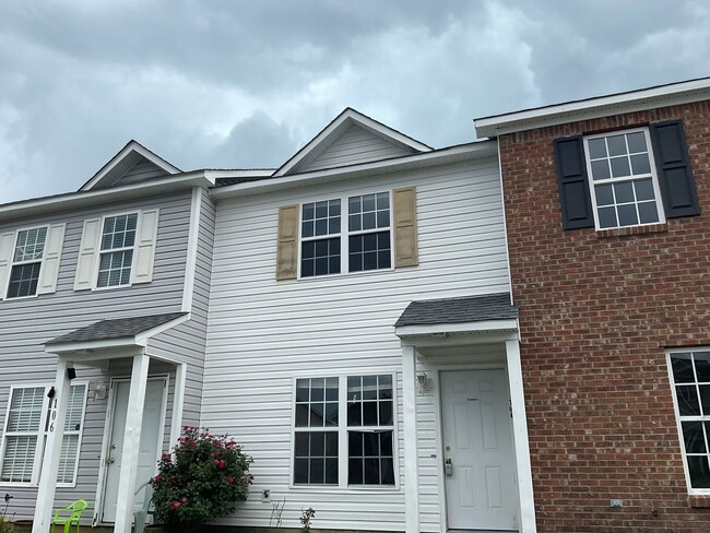 Building Photo - Charming two bedroom two and a half bath town home that is centrally located! Minutes to Camp Lej...