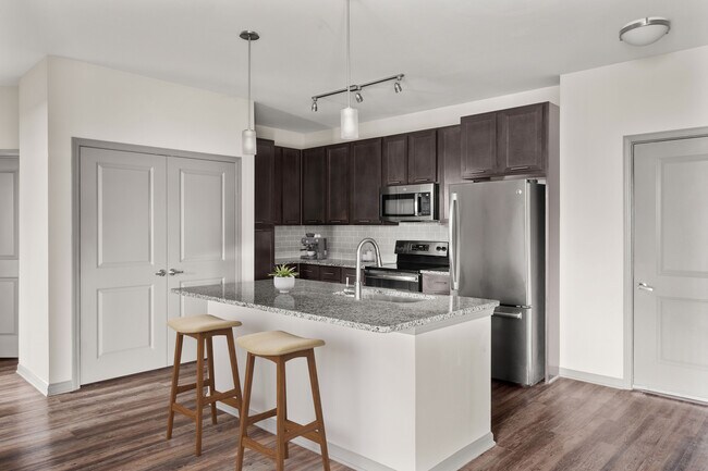 Create meals and memories in your modern kitchen. - 1760 Apartments