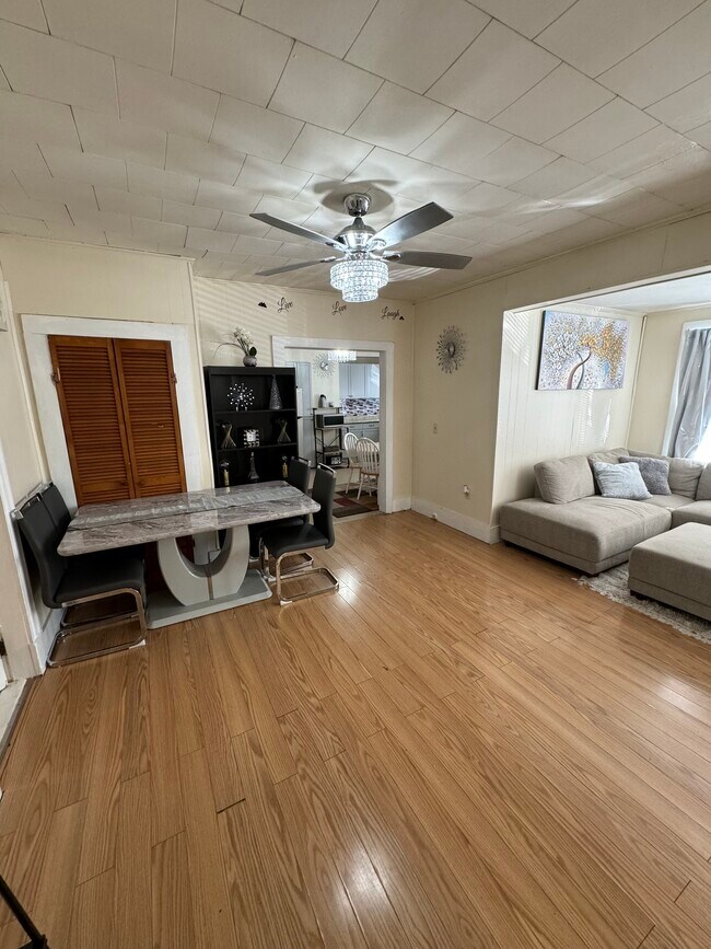 Dining/living area with ceiling fan - 25 Salem St Apartments Unit 25 Salem Street