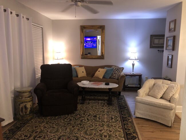 Evening glow in the living room. - 3565 Sable Palm Ln Condo Unit VILLAS AT LACITA