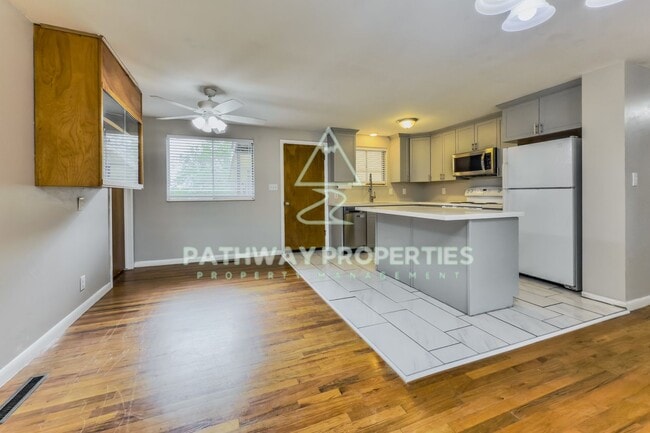 Photo - Charming 3-Bed, 1.5-Bath Brick Home with Spacious Living & Outdoor Retreat in Clearfield, UT!