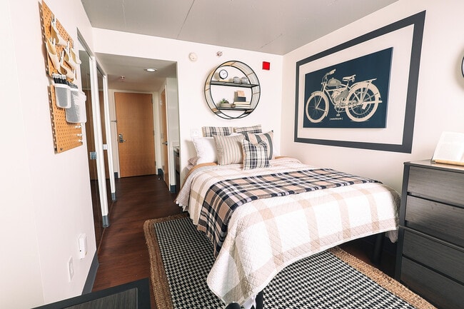 Experience tranquility in this chic bedroom designed for comfort and style. - Avery Philly