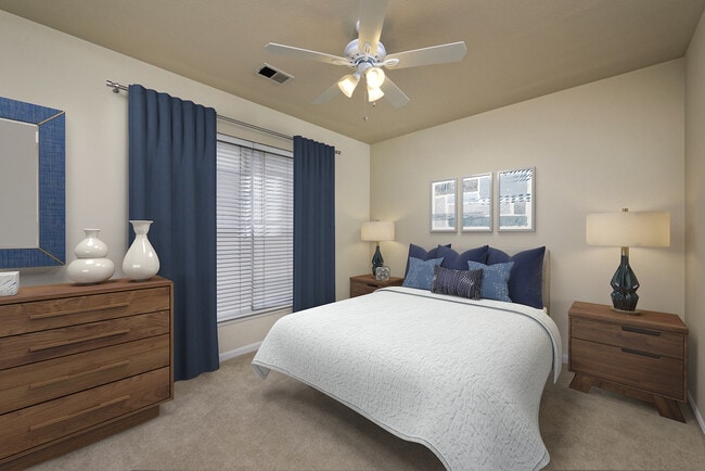 Renovated Package I bedroom with ceiling fan and carpeted flooring