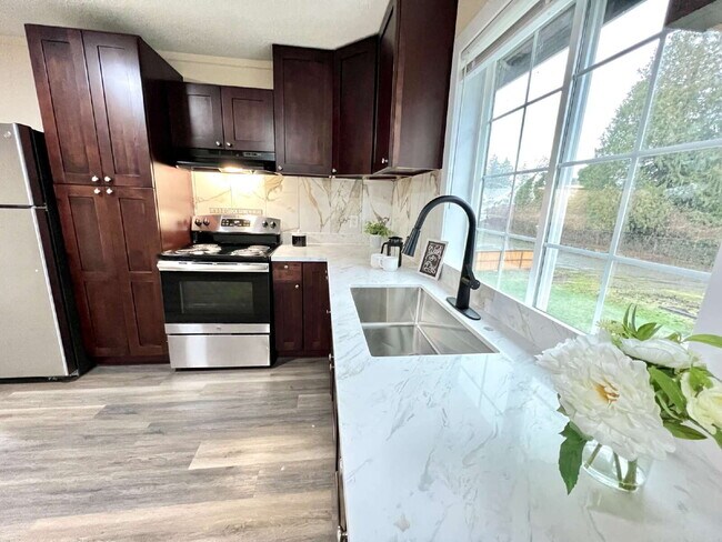 Photo - Elevated 3-Bedroom Home with Secure Garage & Cozy Living Space Unidad C