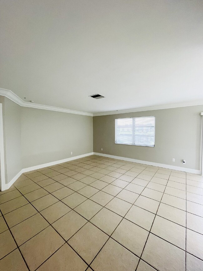 Photo - Updated 2-bedroom waterfront duplex with walk-in closets, enclosed Florida room, and canal views ... Unit B