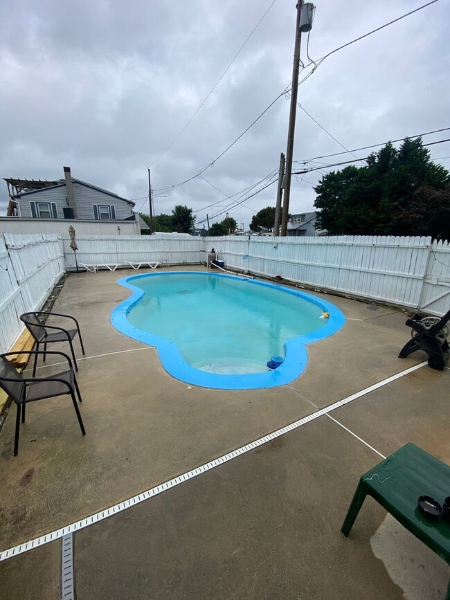 Photo - Beautiful three bed, 1.5 bath single-family home for rent with inground pool