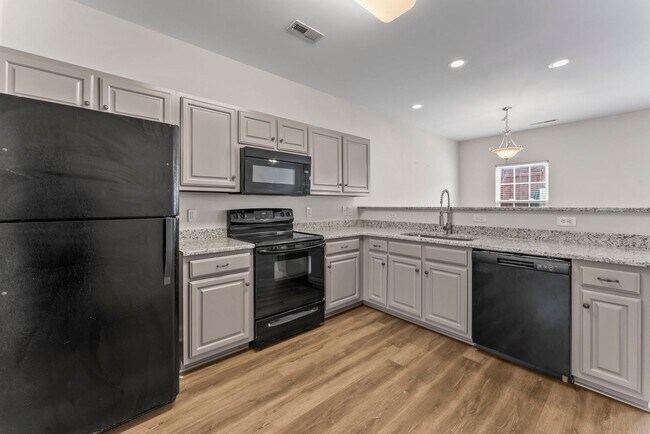 Photo - Updated 2BR Townhome with Dual Primary Suites & Walk-In Closets!