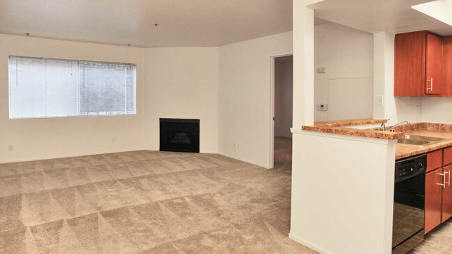Carpeted Living Room with Fireplace