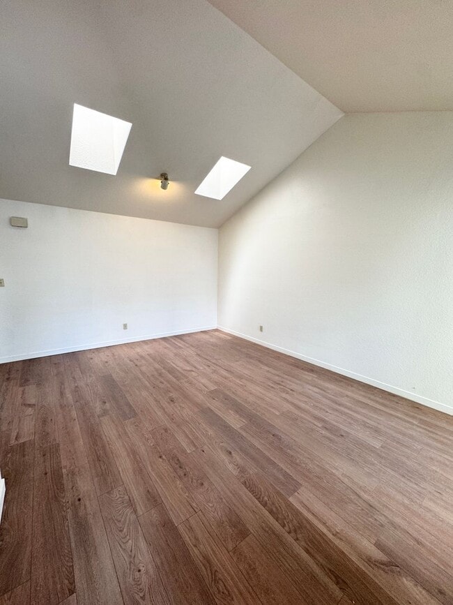 Photo - Spacious 2BD/2BA Upstairs Condo in Gated Community – Pool, Skylights & W/D Included!