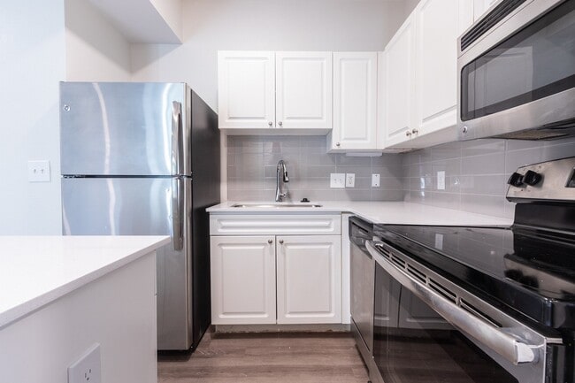 Renovated kitchens include stainless steel appliances and quartz countertops