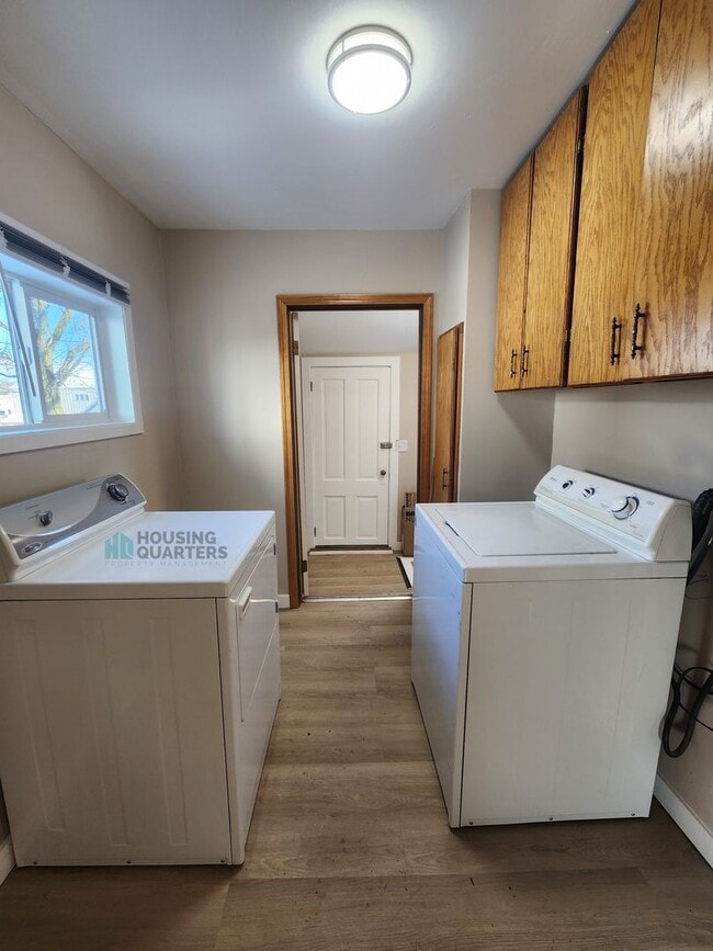 Photo - This 3-bed, 1-bath home features original woodwork, a covered front porch, a fenced yard, and an ...