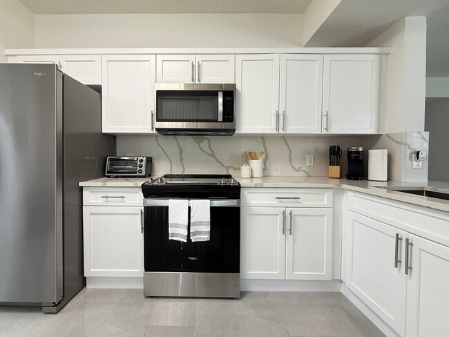 Building Photo - 11024 Legacy Dr Unit 102 Rental