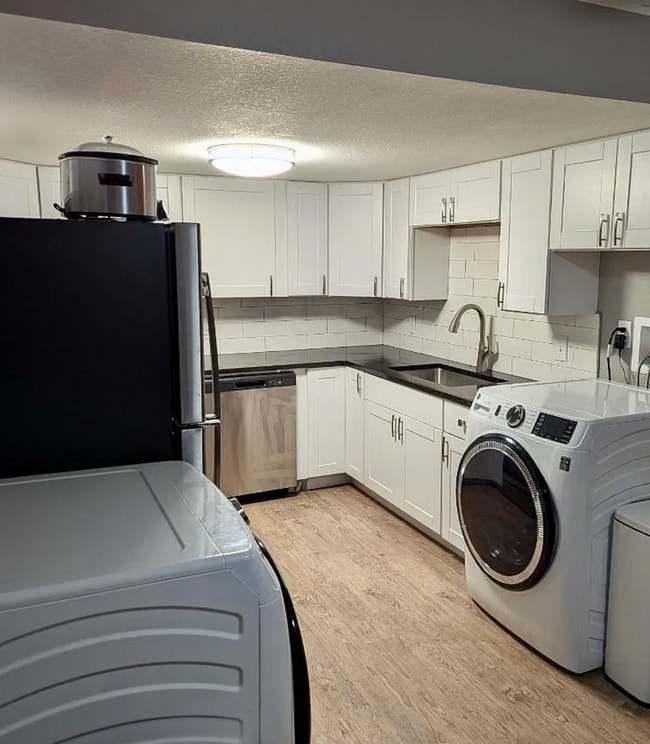 Photo - Beautifully Renovated 3 Bedroom Apartment with Private Balcony, In-Unit Laundry & A/C Unit 5