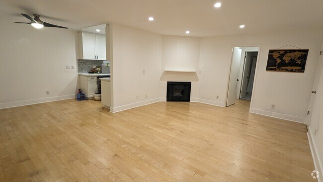 Entry way, living room, fireplace, dinning room. - 3131 S Canfield Ave Unit Canfield Rental