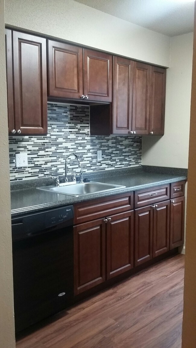 Tile Backsplashes and Cinnamon Oak Cabinetry