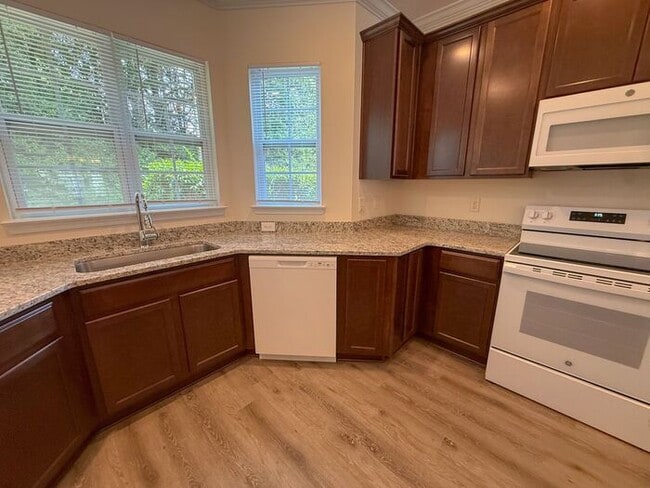 Photo - Beautifully updated Townhome! New cabinets, granite counter tops, and LVP flooring through downst...