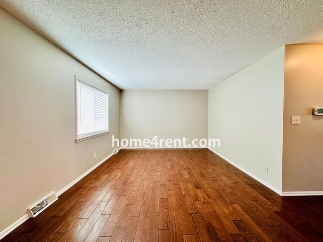 Photo - Beautiful Overland Park Townhome w/ Wood Floors, Large Open Kitchen and a Community Pool!
