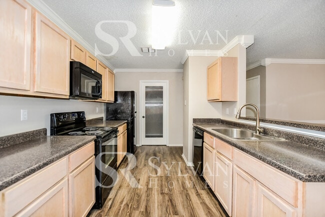 Photo - The living is easy in this gorgeous 4BR, 2.5BA brick home