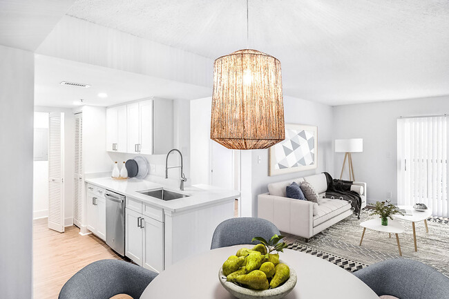 Newly renovated interiors in select homes. Including brand new stainless-steel appliances, quartz countertops, new cabinetry and vinyl plank flooring. - Windsor Coconut Creek Apartments