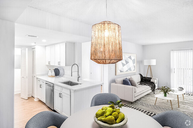 Discover newly renovated interiors in select homes, complete with brand new stainless-steel appliances, quartz countertops, modern cabinetry, and stylish vinyl plank flooring. - Windsor Coconut Creek Rental