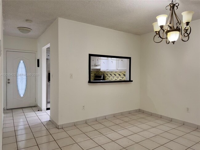 Building Photo - 1035 W 77th St Unit 211
