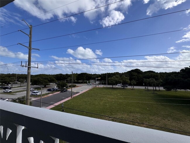 Building Photo - 8233 Harding Ave Unit 403