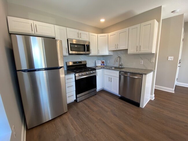 Kitchen with stainless steel appliances - 115 Susquehanna Ave Unit 2