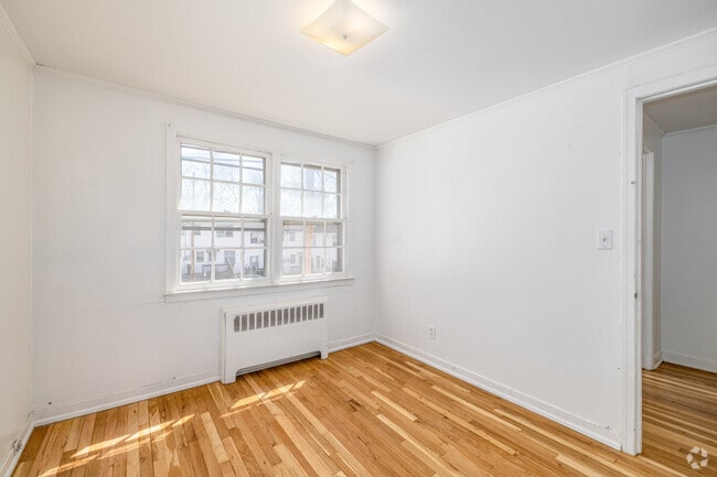 2BR, 1BA - 763SF - Primary Bedroom - Rockaway Gardens Apartments