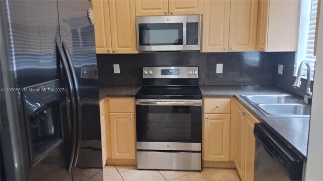 Photo - 7965 W 33rd Ln Townhome