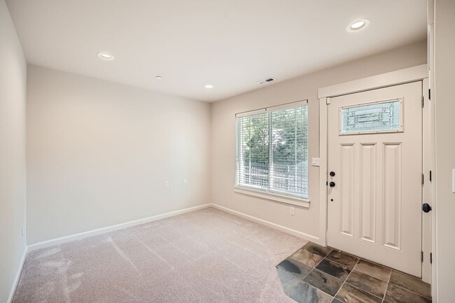 Photo - Charming three-level Townhome available for immediate move in.