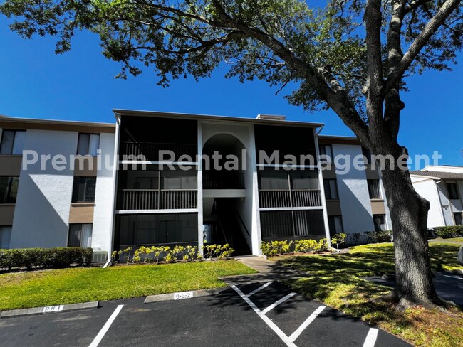 Building Photo - 1 Bedroom 2nd Floor Condo in East Orlando with Laminate Flooring and Scenic Balcony View! Unit 72