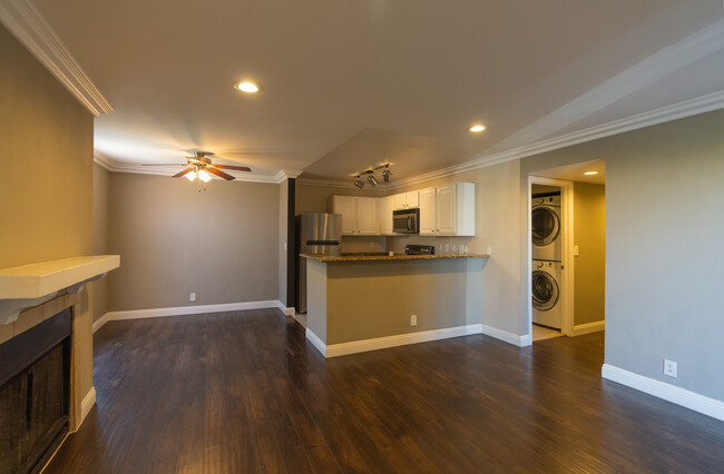 Inside living room, dining room and kitchen - 4050 Pacific Harbors Dr Condo Unit 115