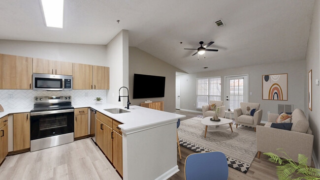 Beautifully remodeled kitchen with quartz countertops - Preston Hills at Mill Creek Apartments
