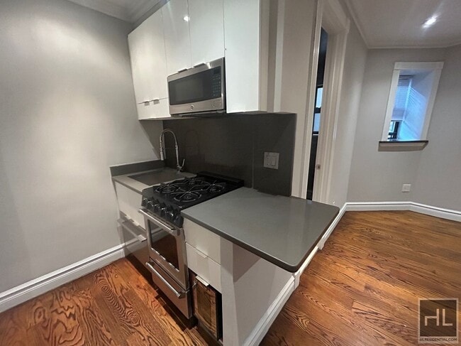 Building Photo - East 25th Street Unit B