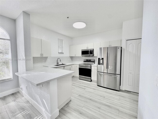 Building Photo - 120 Jacaranda Country Club Dr Unit 101