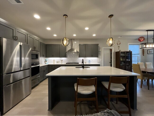 Photo - Modern 5 Bedroom Home in Reed’s Crossing Featuring Guest Suite, Open Floor Plan, and EV Charger