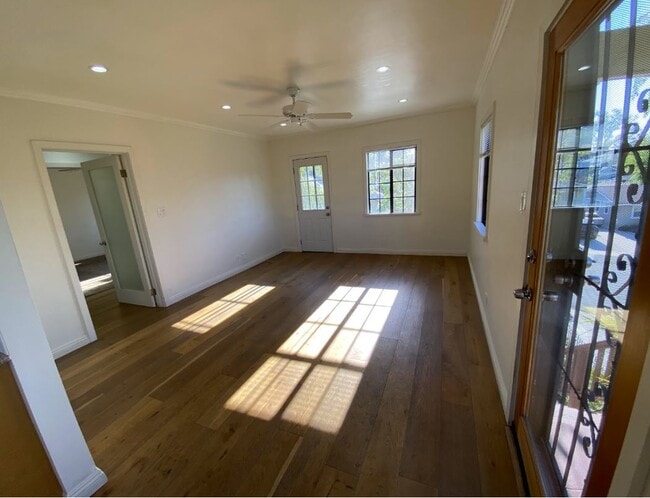 Living room / Front door entrance (Right). Open doorway (Left) leads to hallway for bedrooms/bath - 1733 Phillips Way